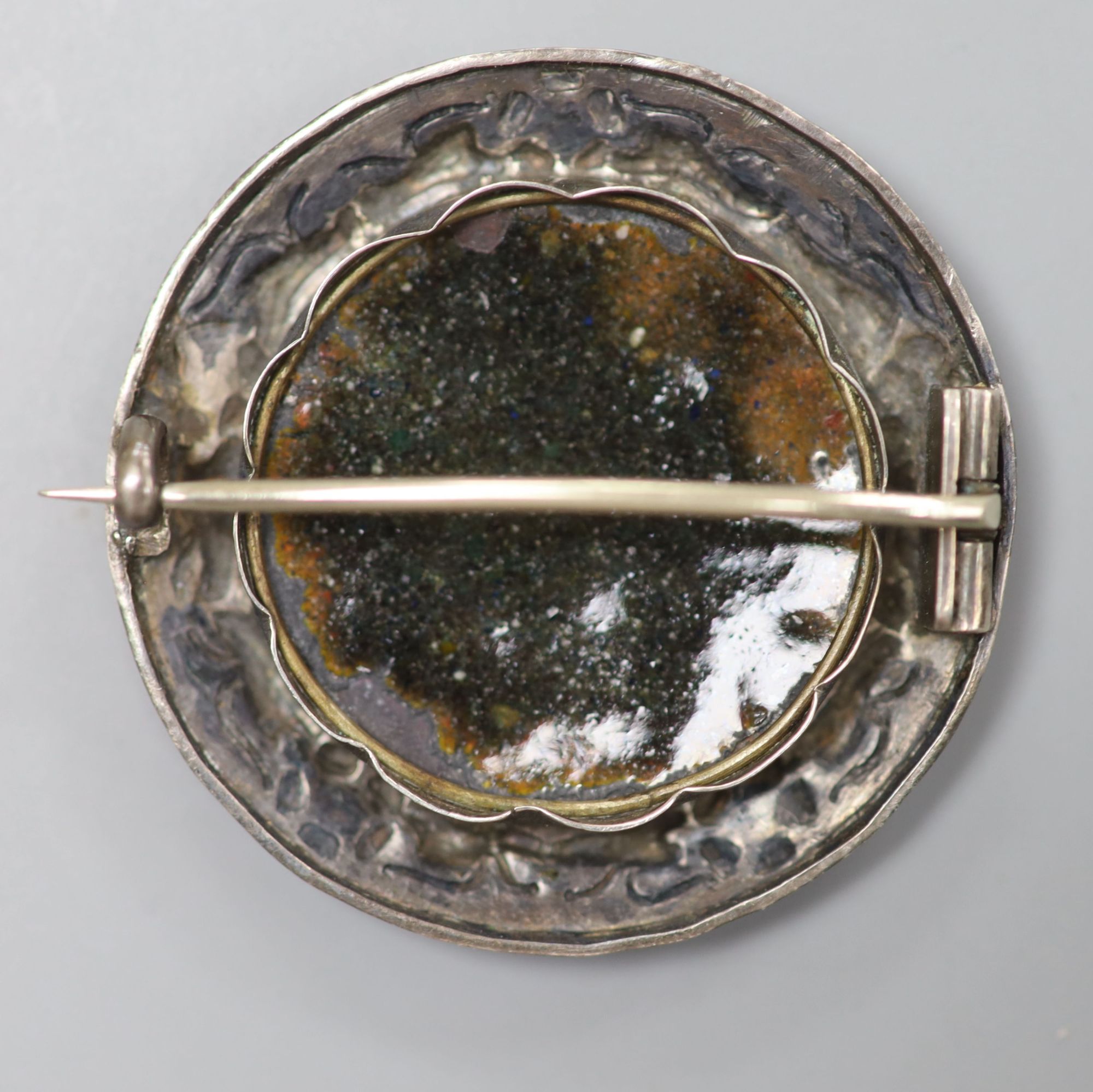 An early 20th century French white metal and turquoise mounted Limoges? enamel circular brooch, 39mm, gross 10 grams.